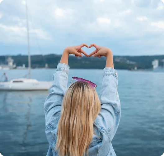 girl showing heart sign